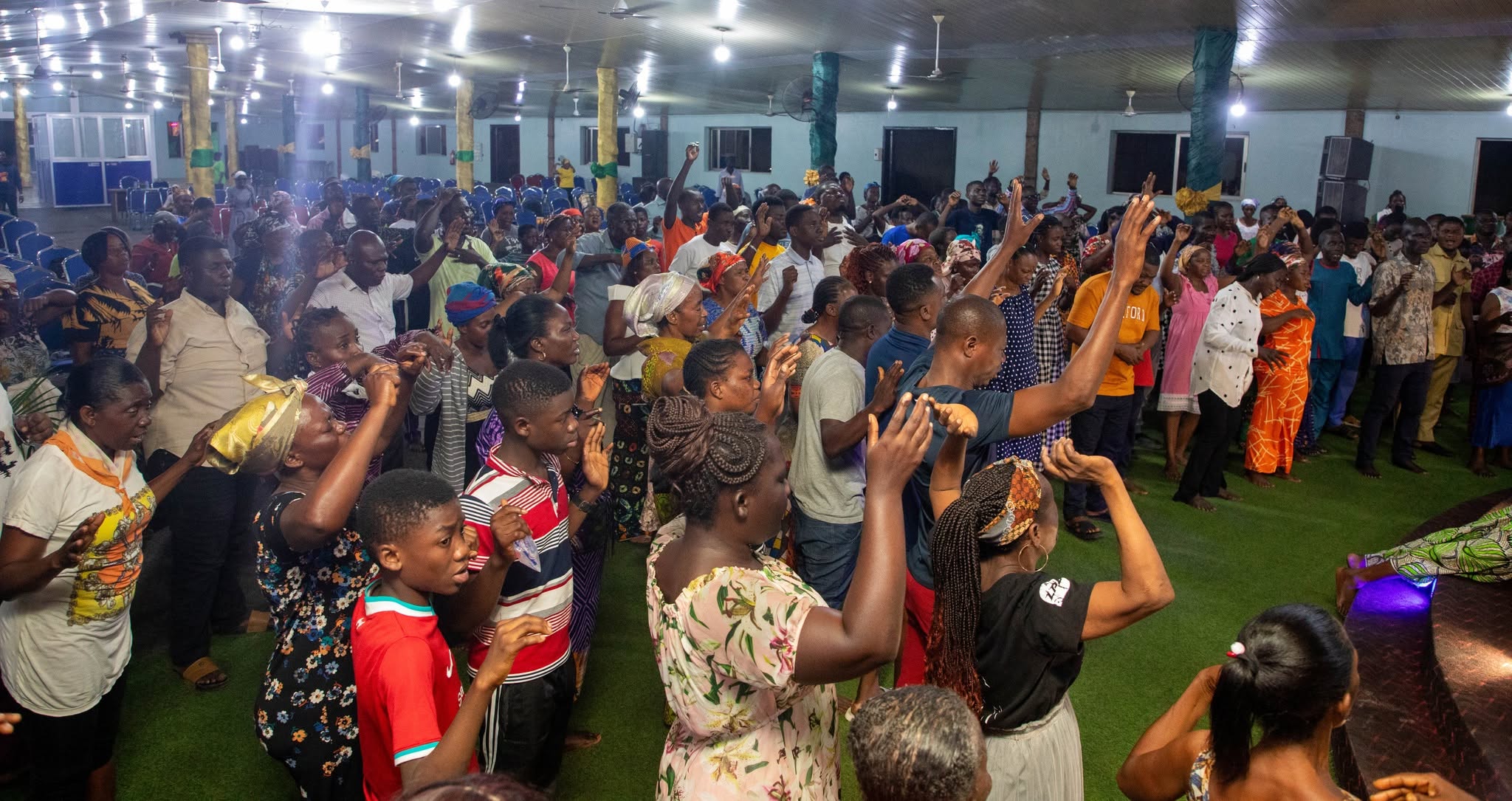 Crowd with raised hands at worship concert